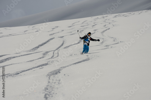 Ski, Snowboard freeride i deep powder snow. Gudauri Georgia Caucasus resort. Freeride in Caucasus mountains. Freeride snowboarding in winter. Heliboarding freeride. Riding in powder on snowborad. photo