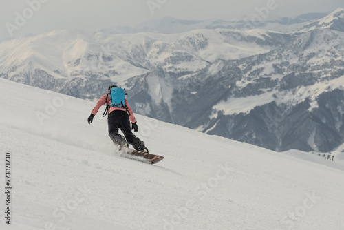 Ski, Snowboard freeride i deep powder snow. Gudauri Georgia Caucasus resort. Freeride in Caucasus mountains. Freeride snowboarding in winter. Heliboarding freeride. Riding in powder on snowborad. photo