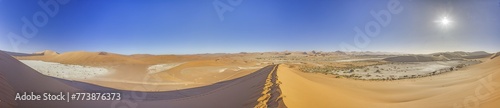 Panoramic view from the Big Daddy Dune in Sussusvlei onto the salt pan of Deathvlei with surrounding red dunes in the morning photo