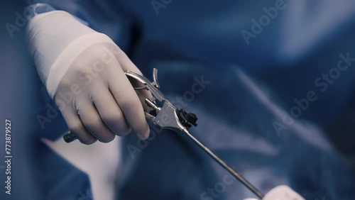 Professional surgeons in the operating room. Instrument for laparoscopic surgery. A surgeon performs laparoscopic gastric surgery in the operating room. photo