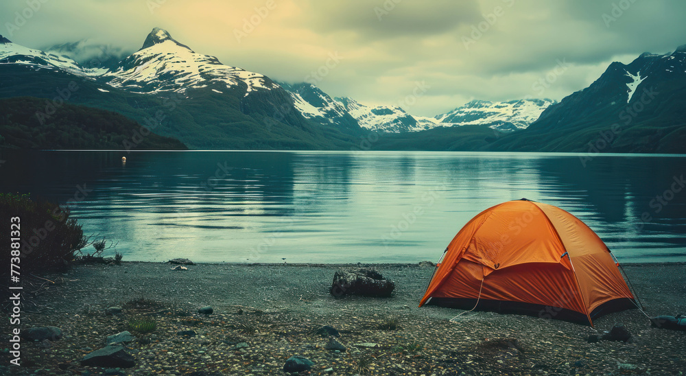 Explore iconic vistas of snow-capped peaks and an orange tent in tranquil waters, shot with Provia film. The Y2K aesthetic and generative AI techniques enhance the atmosphere.
