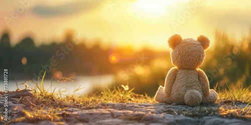 Delight in the solitude of a plush teddy bear watching the sunset with vast copy space. AI generative enhancements add depth.