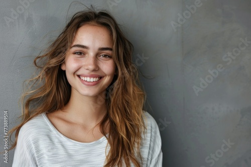 Happy Pretty Woman. Young Female with Dark Eyes Smiling Joyfully at Camera in Studio Shot