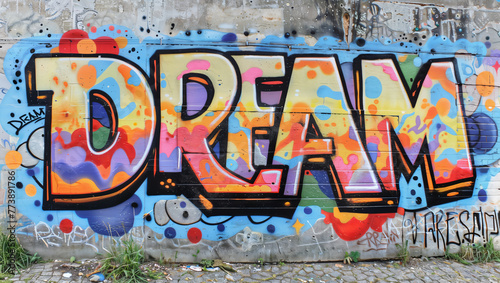 The word  DREAM  as an artistic illustration graffiti on an old concrete wall in colorful hues.