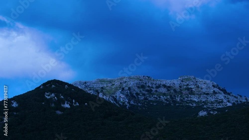 Time lapse of the sunset at Mount Candina in Liendo. Liendo Valley, Eastern Coastal Mountain, Cantabrian Sea, Cantabria, Spain, Europe photo