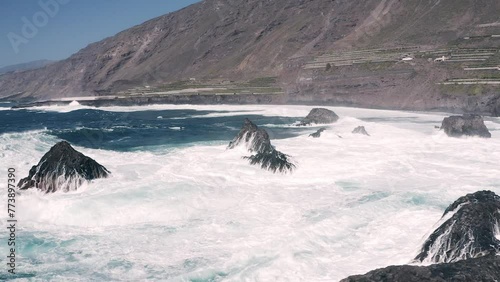 BIG WAVES CRASHING AGAINST THE ROCKS ON THE COSAT