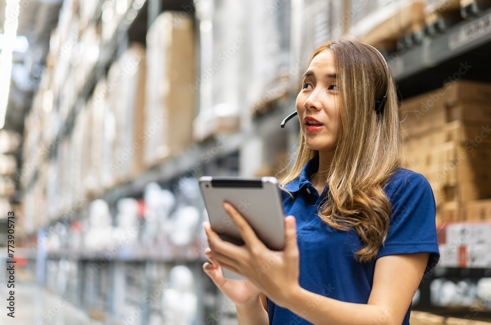 Female engineer is handling shipping and checking stock inventory in the warehouse with a tablet, industry, import-export, inventory management, logistics, global transportation at warehouse, business Female engineer is handling shipping and checking stock inventory in the warehouse with a tablet, industry, import-export, inventory management, logistics, global transportation at warehouse, business