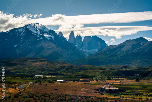 Las Torres Base behind the mountain and city as foreground and dramatic cloud (Patagonia, Chile, torres del paine)