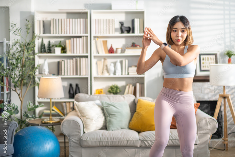 Portrait of sport slim fit strength asian woman training in sportswear relax and practicing yoga, fitness, exercise, wellness, workout, sport at home.Diet concept.Fitness and healthy lifestyle Portrait of sport slim fit strength asian woman training in sportswear relax and practicing yoga, fitness, exercise, wellness, workout, sport at home.Diet concept.Fitness and healthy lifestyle