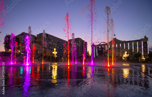 Evening Elegance: Illuminated Fountain Shines in the Night