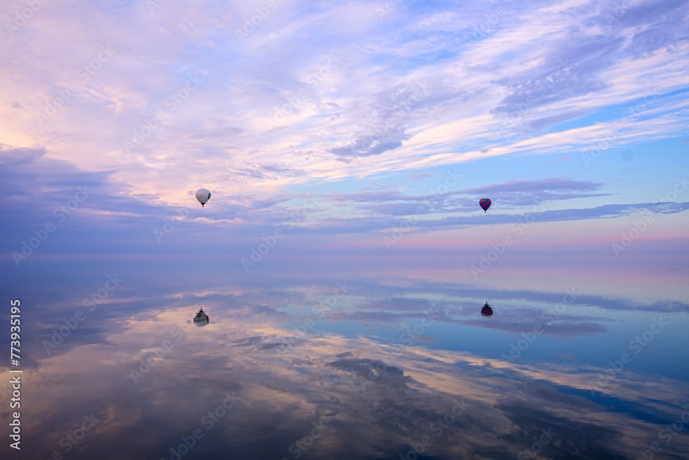 Skyward Drift: Wind Ball Soars Above Water Against the Sky Skyward Drift: Wind Ball Soars Above Water Against the Sky
