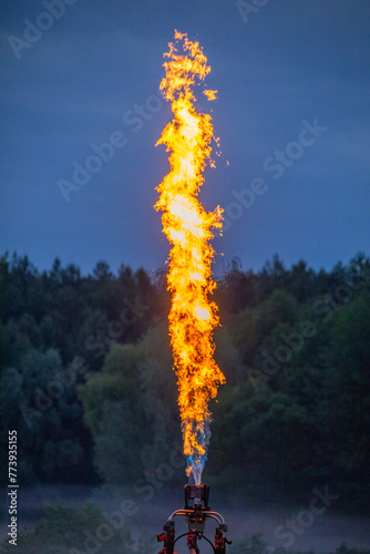 Celestial Bonfire: Gas Burner Flames Flicker in the Evening Sky
