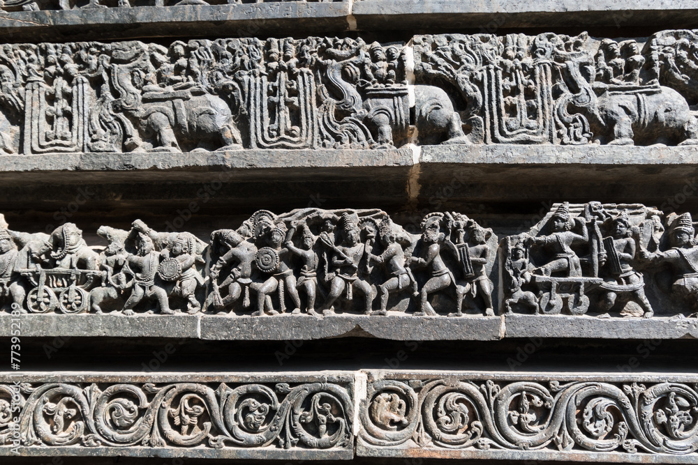 Beautiful stone carvings on the walls of the ancient Hoysaleshwara temple in Halebidu in Karnataka.