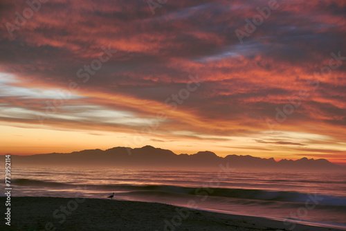 Beautiful Sunrise Morning Over Beach And Sea Looking Towards Mountains In South Africa