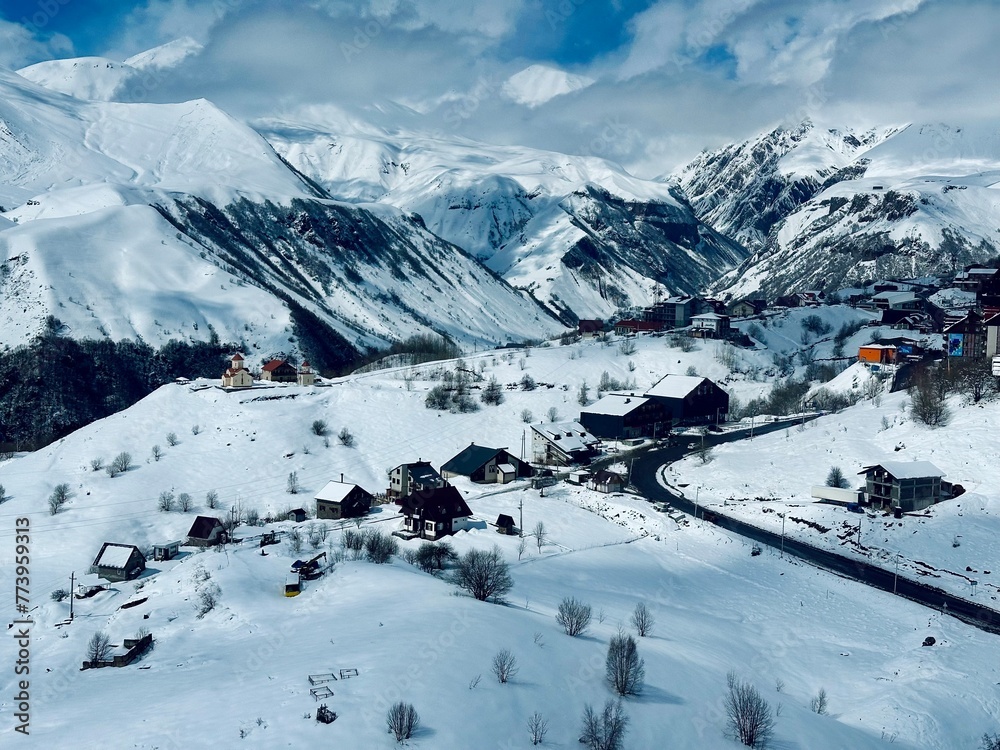 Gudauri Village Panorama With Ski Resort Background From Aerial Perspective. Aerial drone view of Gudauri ski resort in winter. Caucasus mountains in Georgia