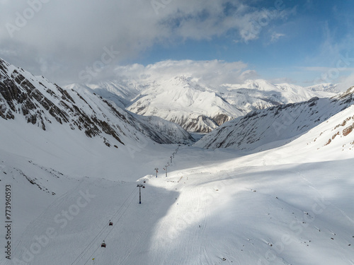  Kudebi, Bidara, Sadzele, Kobi aerial panorama in caucasus winter mountains. Aerial drone view of Gudauri ski resort in winter. Caucasus mountains in Georgia © Chawran