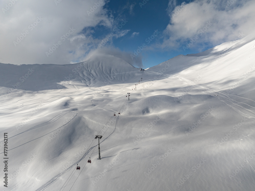  Kudebi, Bidara, Sadzele, Kobi aerial panorama in caucasus winter mountains. Aerial drone view of Gudauri ski resort in winter. Caucasus mountains in Georgia