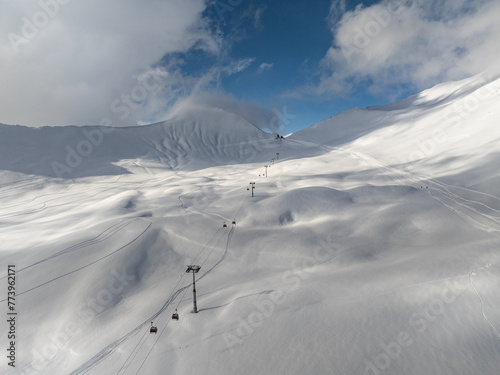  Kudebi, Bidara, Sadzele, Kobi aerial panorama in caucasus winter mountains. Aerial drone view of Gudauri ski resort in winter. Caucasus mountains in Georgia © Chawran