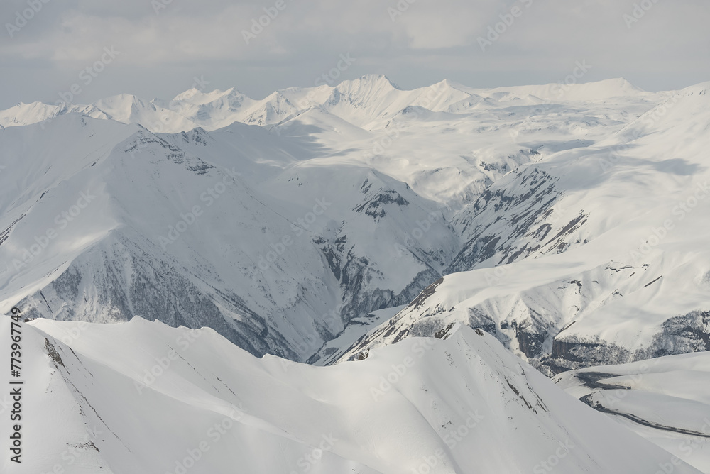 Aerial drone view of Gudauri ski resort in winter. Caucasus mountains in Georgia.  Kudebi, Bidara, Sadzele, Kobi aerial panorama in caucasus winter mountains.