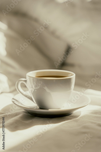moody cup of coffee in bed. Morning coffe time.