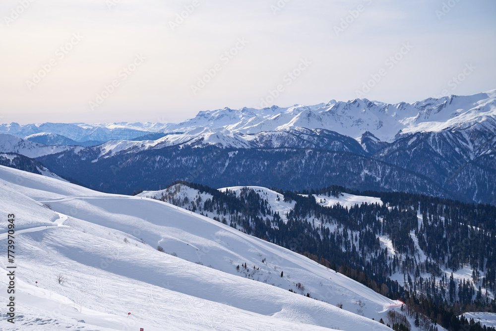 Panoramic view of snow-covered slopes