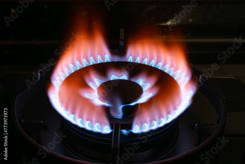 gas burning from a kitchen gas stove in dark
