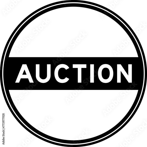 Black color round seal sticker in word auction on white background