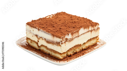 A delectable piece of cake sitting on a delicate plate against a clean white backdrop