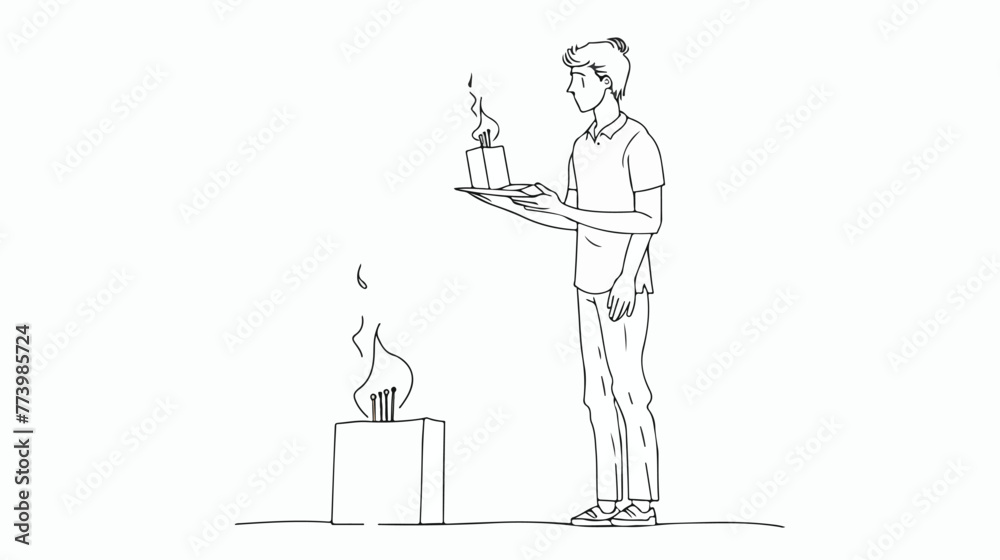 Man stands looking at a burning match in his hand with