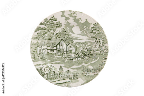 Vintage plate with green painting isolated on white background.
