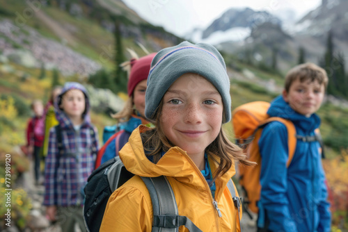Active young kids, teenagers hiking in the mountains, summer camp