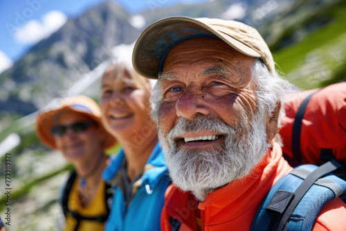 Active Mature senior people hiking in the mountains © aamulya