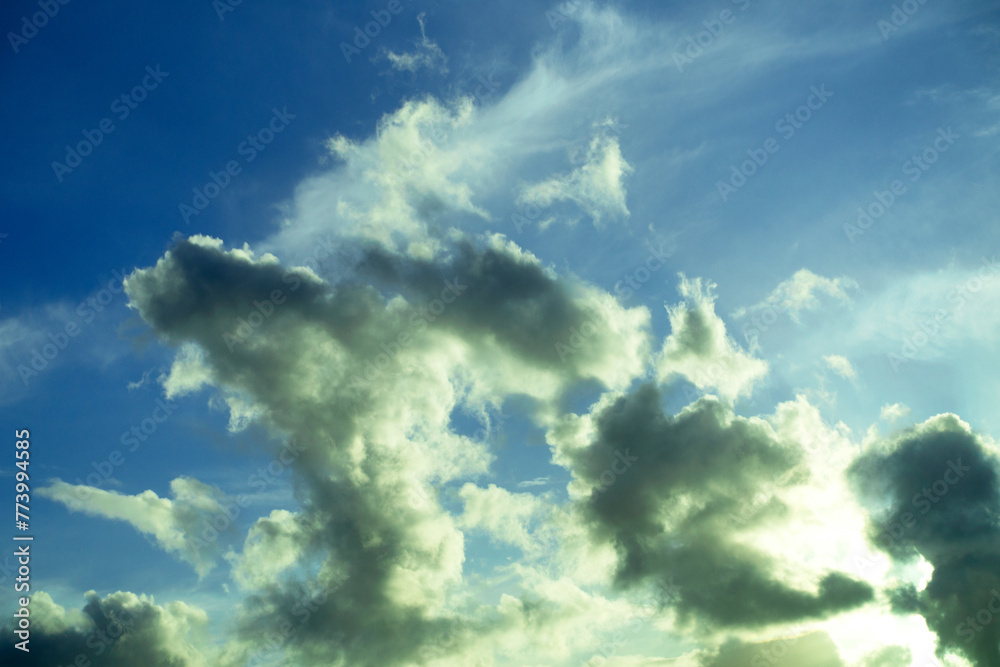 Fototapeta premium Landscape with big heavy fluffy clouds on a blue background