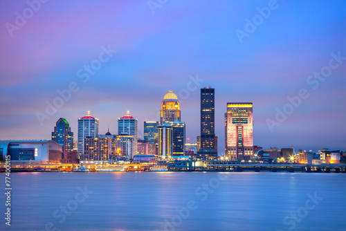 Louisville, Kentucky, USA. Cityscape image of Louisville, Kentucky, USA downtown skyline with reflection of the city the Ohio River at spring sunrise.