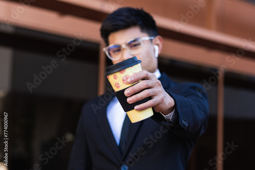 Businessman holding a reusable cup