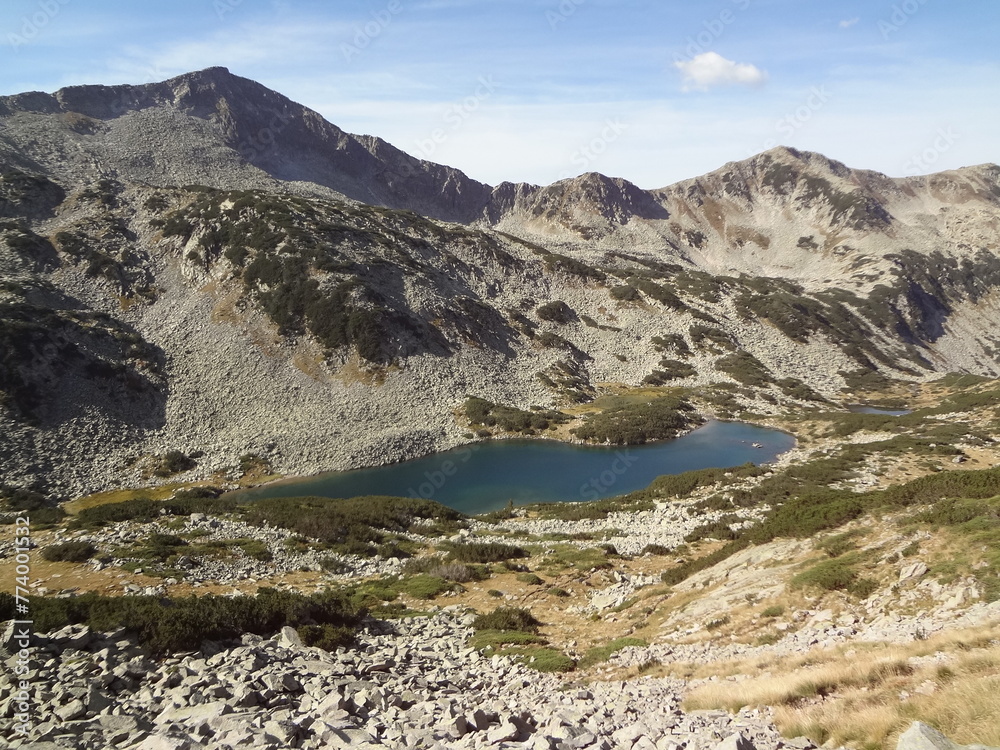 Mountain lake surrounded by rocky cliffs.