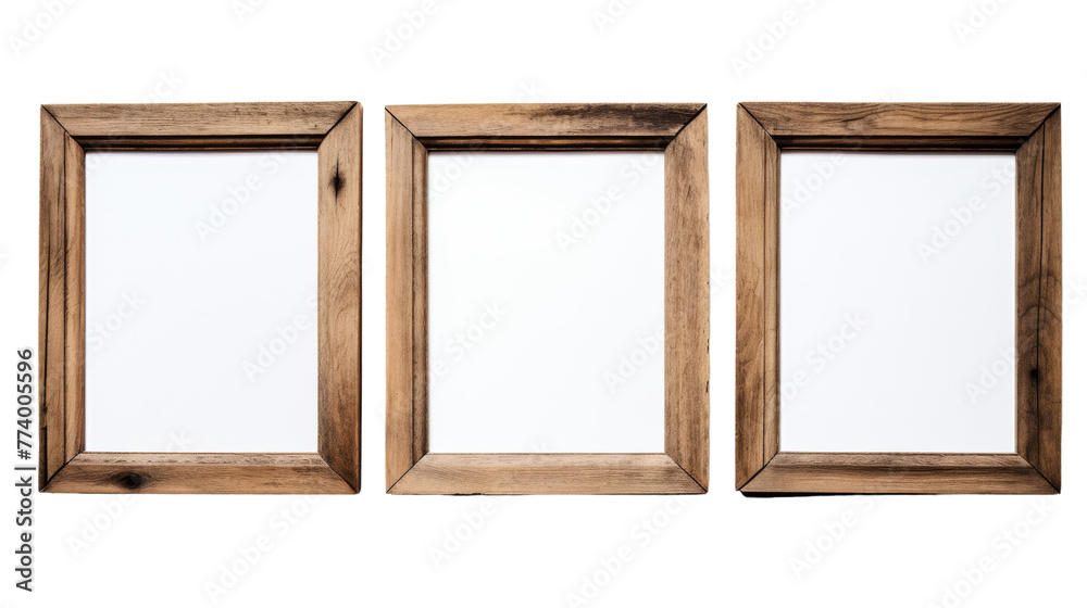 Three wooden frames rest against a bright white backdrop Three wooden frames rest against a bright white backdrop