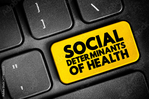 Social determinants of health - economic and social conditions that influence individual and group differences in health status, text concept button on keyboard photo