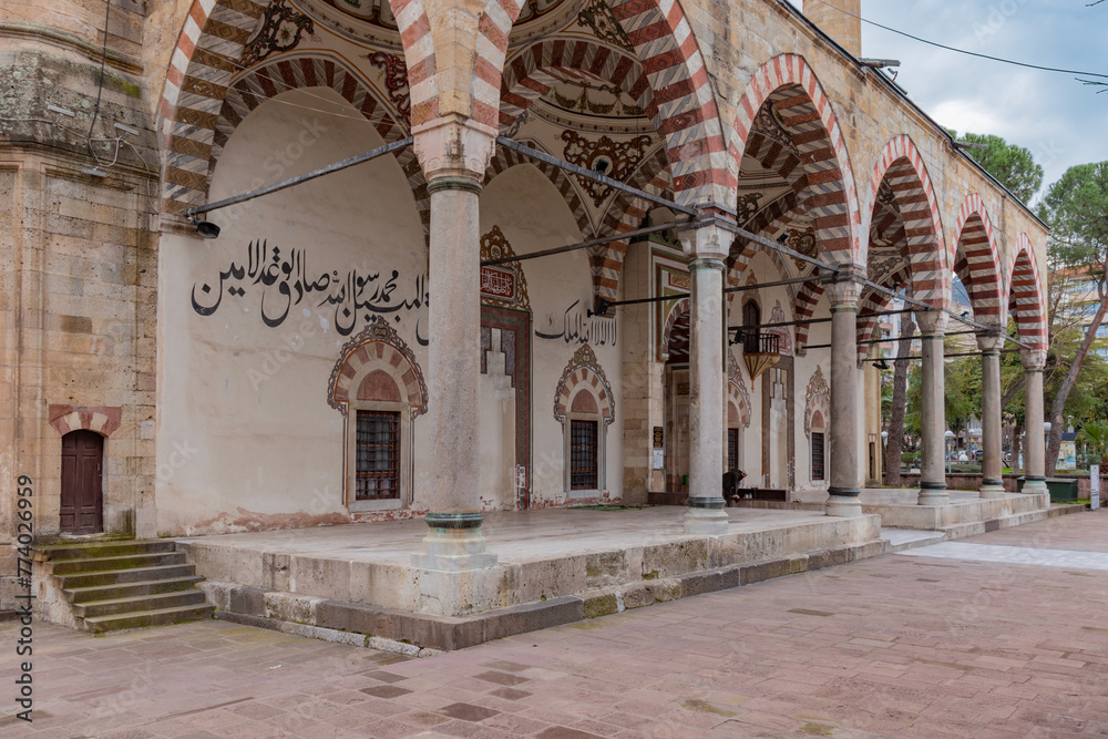 Arched building decorations in front of the entrance door of Manisa Sultan Mosque from a side angle
