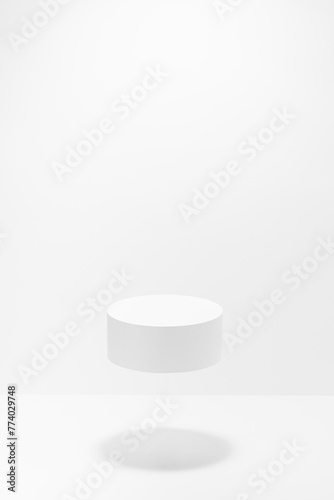 One round white podium for cosmetic products mockup, soar in hard light shadow, white background. Stage for presentation skin care products, gifts, goods, advertising, design, sale, display, showing.