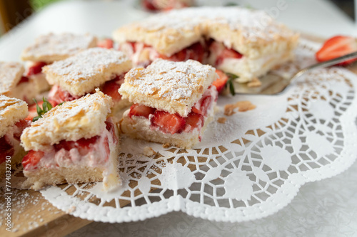 Strawberry sponge cake with delicious cream filling and almond topping
