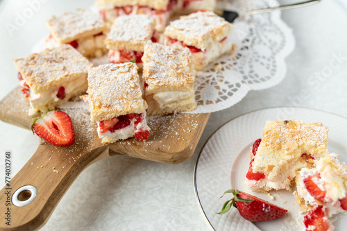 Strawberry sponge cake with delicious cream filling and almond topping