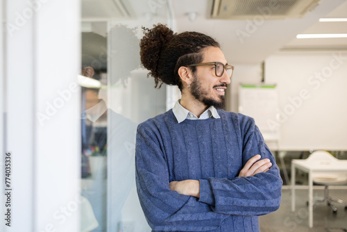 Confident man in office environment, casual attire photo