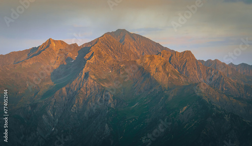 Skhara mountain peak on sunset from udziro lake trekking viewpoint in Georgia. Caucasus mountain landscape photo