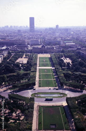 View from the top level of the Eiffel Tower, down the Champ de Mars, with the Tour Montparnasse (Montparnasse Tower) in the distance during 1990s