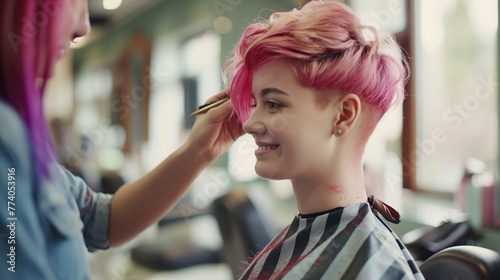 Beautiful girl with pink hair getting her hair cut in a beauty salon
