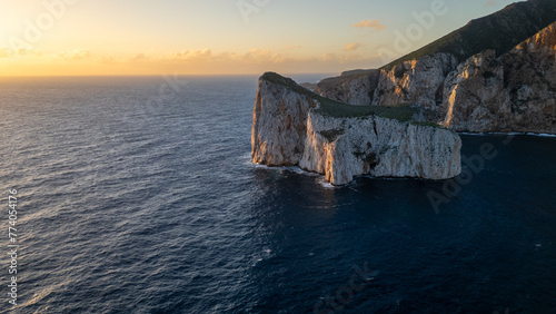 Rough sea in Sardinia near Porto Flavia. Aerial view of Pan di Zucchero and crystal clear sea