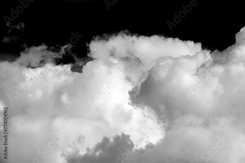 White cloud on a black background. Sharp contrast between the white cloud and the black background. Simple but visually striking design. Emphasizes purity, simplicity and elegance.