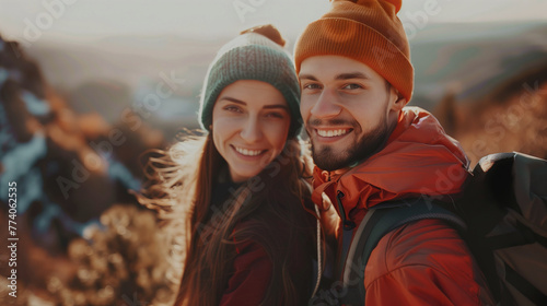 Happy young couple travel and hikeing outdoor adventure in summer. Pretty smiling people are active in nature and taking selfie portrait on phone. Cheerful couple enjoying backpacking life © DigitalDreamscape