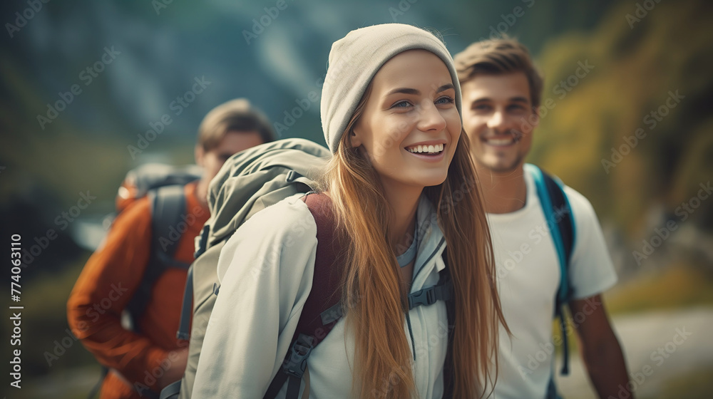 Happy young couple travel and hikeing outdoor adventure in summer. Pretty smiling people are active in nature and taking selfie portrait on phone. Cheerful couple enjoying backpacking life